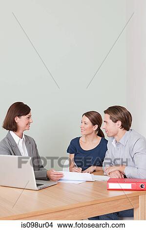 Young couple with financial adviser View Large Photo Image Picture - Young couple with financial adviser. Fotosearch