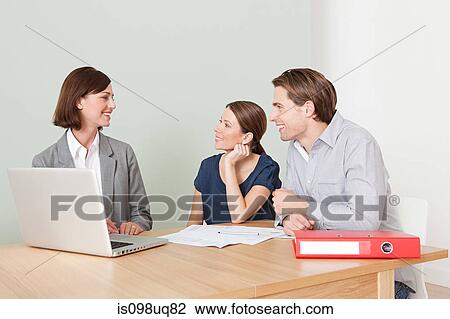 Young couple with financial adviser View Large Photo Image Stock Image - Young couple with financial adviser. Fotosearch