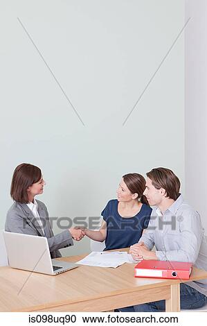 Young couple with financial adviser View Large Photo Image Stock Image - Young couple with financial adviser. Fotosearch