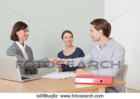 Young couple with financial adviser View Large Photo Image Stock Photo - Young couple with financial adviser. Fotosearch