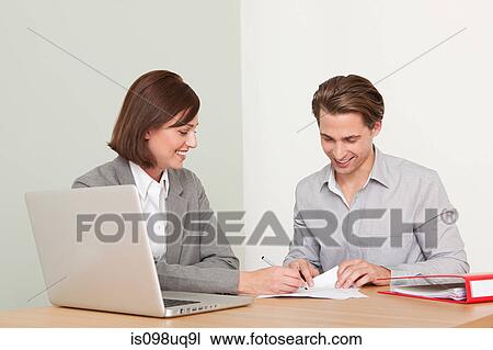 Young man with financial adviser View Large Photo Image Stock Image - Young man with financial adviser. Fotosearch