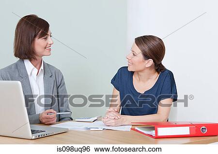 Young woman with financial adviser View Large Photo Image Stock Photograph - Young woman with financial adviser. Fotosearch