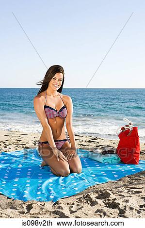 Young woman at the beach View Large Photo Image Stock Image - Young woman at the beach. Fotosearch