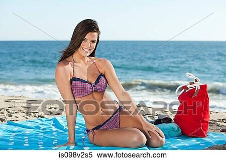 Young woman on the beach View Large Photo Image Stock Photography - Young woman on the beach. Fotosearch