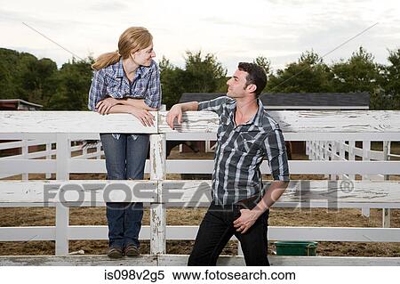 Couple in paddock View Large Photo Image Stock Photography - Couple in paddock. Fotosearch