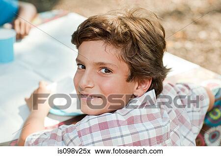 Stock Photo - Boy at birthday party, high angle view. Fotosearch