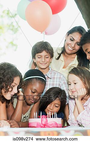 Children at birthday party with birthday cake View Large Photo Image Picture - Children at birthday party with birthday cake. Fotosearch