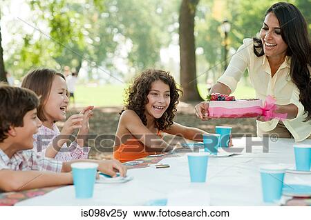Children at birthday party with birthday cake View Large Photo Image Stock Photo - Children at birthday party with birthday cake. Fotosearch