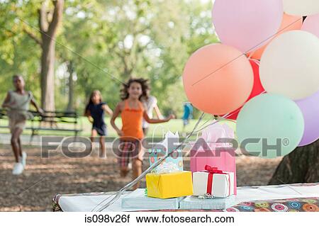 Outdoor birthday party with balloons View Large Photo Image Stock Image - Outdoor birthday party with balloons. Fotosearch