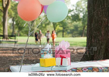 Outdoor birthday party with balloons View Large Photo Image Stock Photo - Outdoor birthday party with balloons. Fotosearch