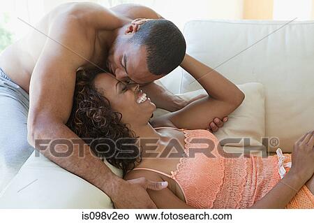 Intimate couple on sofa View Large Photo Image Picture - Intimate couple on sofa. Fotosearch