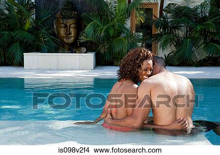 Loving couple in swimming pool View Large Photo Image Picture - Loving couple in swimming pool. Fotosearch