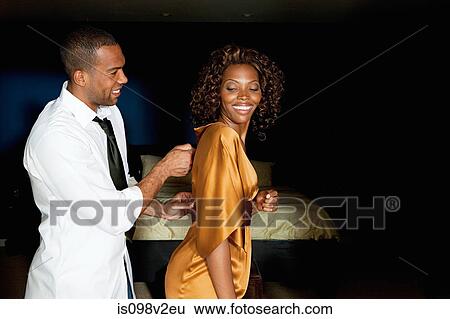 Man zipping up girlfriend's dress View Large Photo Image Stock Photograph - Man zipping up girlfriend's dress. Fotosearch