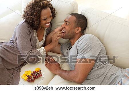 Woman feeding grapes to boyfriend View Large Photo Image Stock Image - Woman feeding grapes to boyfriend. Fotosearch