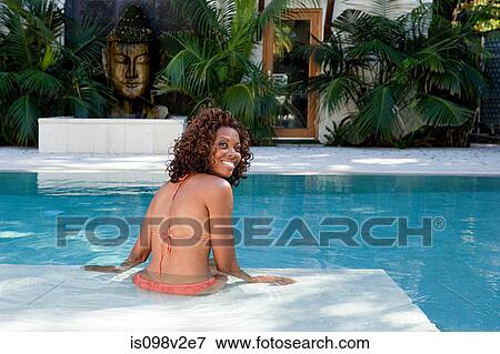 Stock Photo - Young woman in swimming pool. Fotosearch