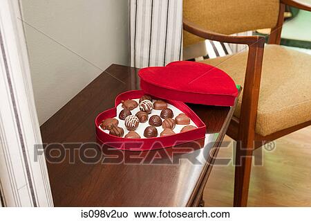 Picture - Chocolates in heart shaped box. Fotosearch