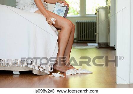 Legs of woman on bed with tissues on floor View Large Photo Image Stock Image - Legs of woman on bed with tissues on floor. Fotosearch