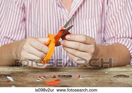 Person cutting paper View Large Photo Image Stock Photography - Person cutting paper. Fotosearch