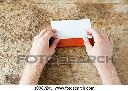 Person folding paper View Large Photo Image Stock Photography - Person folding paper. Fotosearch