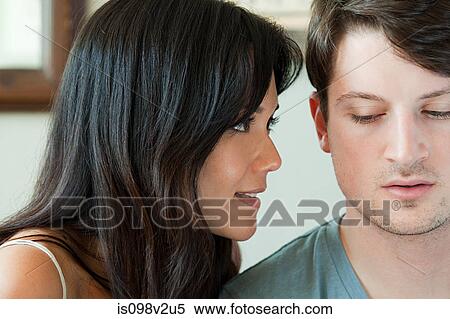 Young woman looking closely at boyfriend View Large Photo Image Stock Photography - Young woman looking closely at boyfriend. Fotosearch
