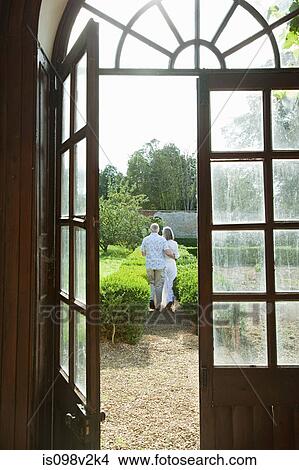 Mature couple by french doors View Large Photo Image Picture - Mature couple by french doors. Fotosearch