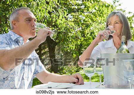 Mature couple drinking wine View Large Photo Image Stock Photograph - Mature couple drinking wine. Fotosearch