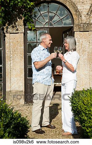 Mature couple drinking wine View Large Photo Image Stock Photograph - Mature couple drinking wine. Fotosearch