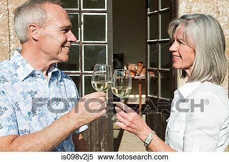 Stock Photography - Mature couple drinking wine. Fotosearch