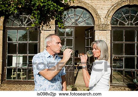 Stock Photography - Mature couple drinking wine. Fotosearch