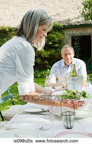 Mature couple having lunch outdoors View Large Photo Image Stock Photograph - Mature couple having lunch outdoors. Fotosearch