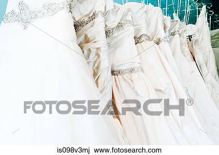 Selection of wedding dresses in boutique View Large Photo Image Stock Image - Selection of wedding dresses in boutique. Fotosearch