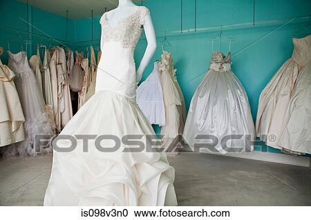 Stock Image - Selection of wedding dresses in boutique. Fotosearch