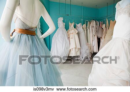 Selection of wedding dresses in boutique View Large Photo Image Stock Photo - Selection of wedding dresses in boutique. Fotosearch