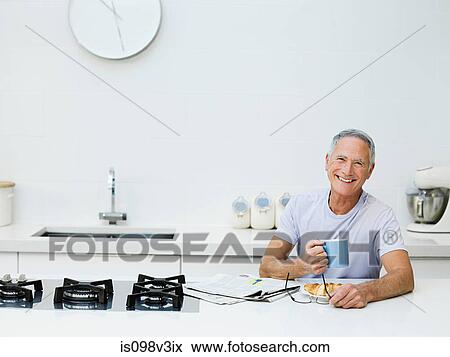 Senior man having breakfast View Large Photo Image Stock Photo - Senior man having breakfast. Fotosearch