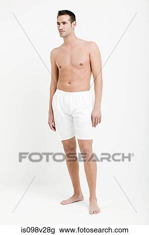 Portrait of young man wearing white boxer shorts View Large Photo Image Stock Image - Portrait of young man wearing white boxer shorts. Fotosearch