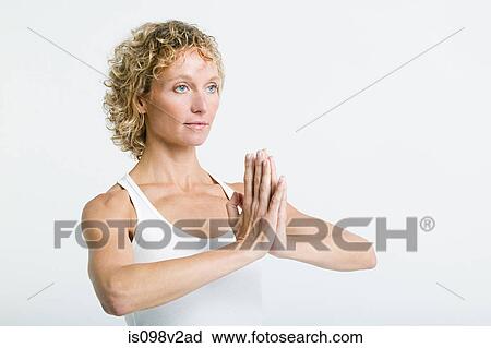 Woman doing prayer pose View Large Photo Image Stock Image - Woman doing prayer pose. Fotosearch