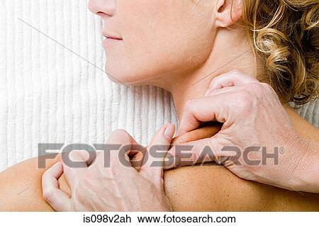 Woman having shoulder massage View Large Photo Image Stock Image - Woman having shoulder massage. Fotosearch