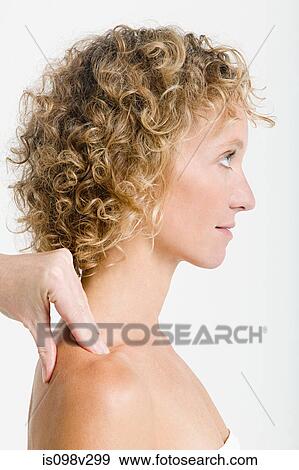 Woman having shoulder massage View Large Photo Image Stock Photo - Woman having shoulder massage. Fotosearch