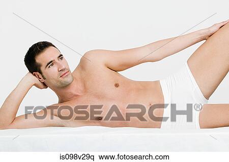 Young man exercising View Large Photo Image Stock Photography - Young man exercising. Fotosearch