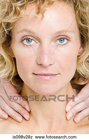 Stock Photo - Young woman having neck massage. Fotosearch