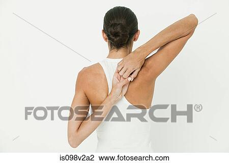 Stock Image - Young woman stretching. Fotosearch