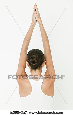 Stock Photo - Young woman stretching. Fotosearch