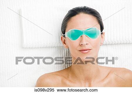 Young woman wearing green eye mask View Large Photo Image Stock Photography - Young woman wearing green eye mask. Fotosearch