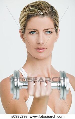 Young woman with hand weights View Large Photo Image Stock Photograph - Young woman with hand weights. Fotosearch