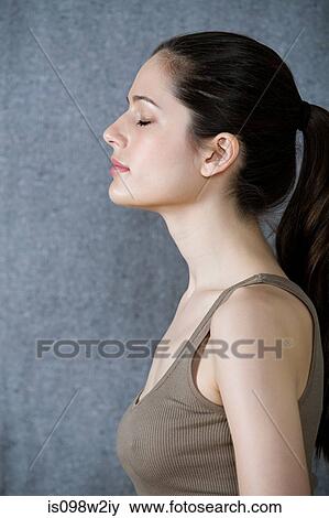 Serene woman with eyes closed View Large Photo Image Stock Photo - Serene woman with eyes closed. Fotosearch