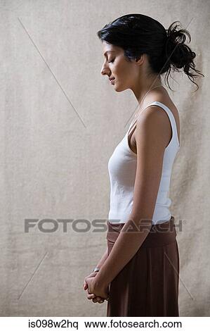 Stock Photography - Serene woman with eyes closed. Fotosearch