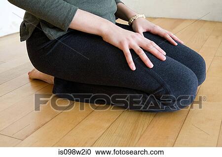 Woman kneeling View Large Photo Image Stock Image - Woman kneeling. Fotosearch