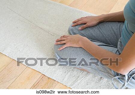 Stock Photography - Woman kneeling. Fotosearch
