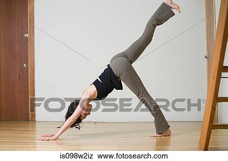 Stock Photo - Woman practicing yoga. Fotosearch