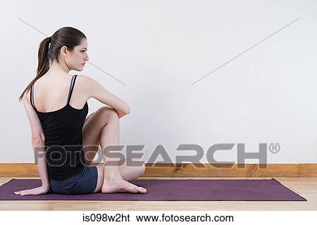 Woman stretching during yoga View Large Photo Image Stock Photograph - Woman stretching during yoga. Fotosearch